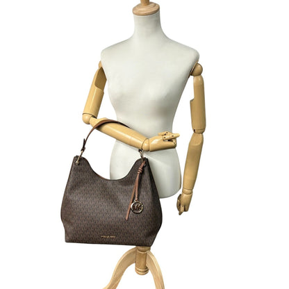 Michael Kors One-Shoulder Hobo Bag With Signature Mk Logo Charm In Brown Leather