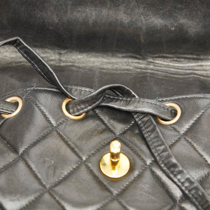 Chanel Matelasse Coco Mark Chain Backpack In Black Lambskin