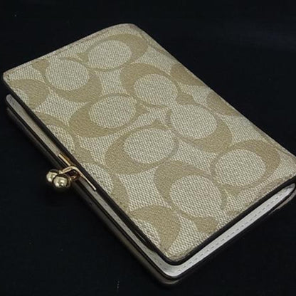 Coach Kisslock Medium Bifold Wallet C8724 In Beige Signature Canvas