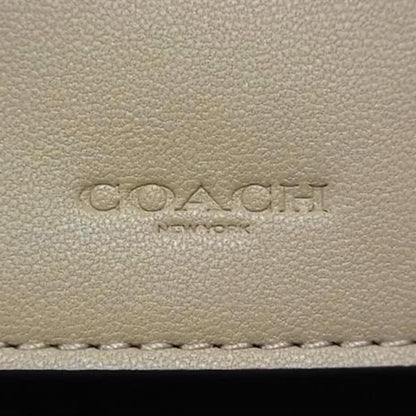 Coach Kisslock Medium Bifold Wallet C8724 In Beige Signature Canvas