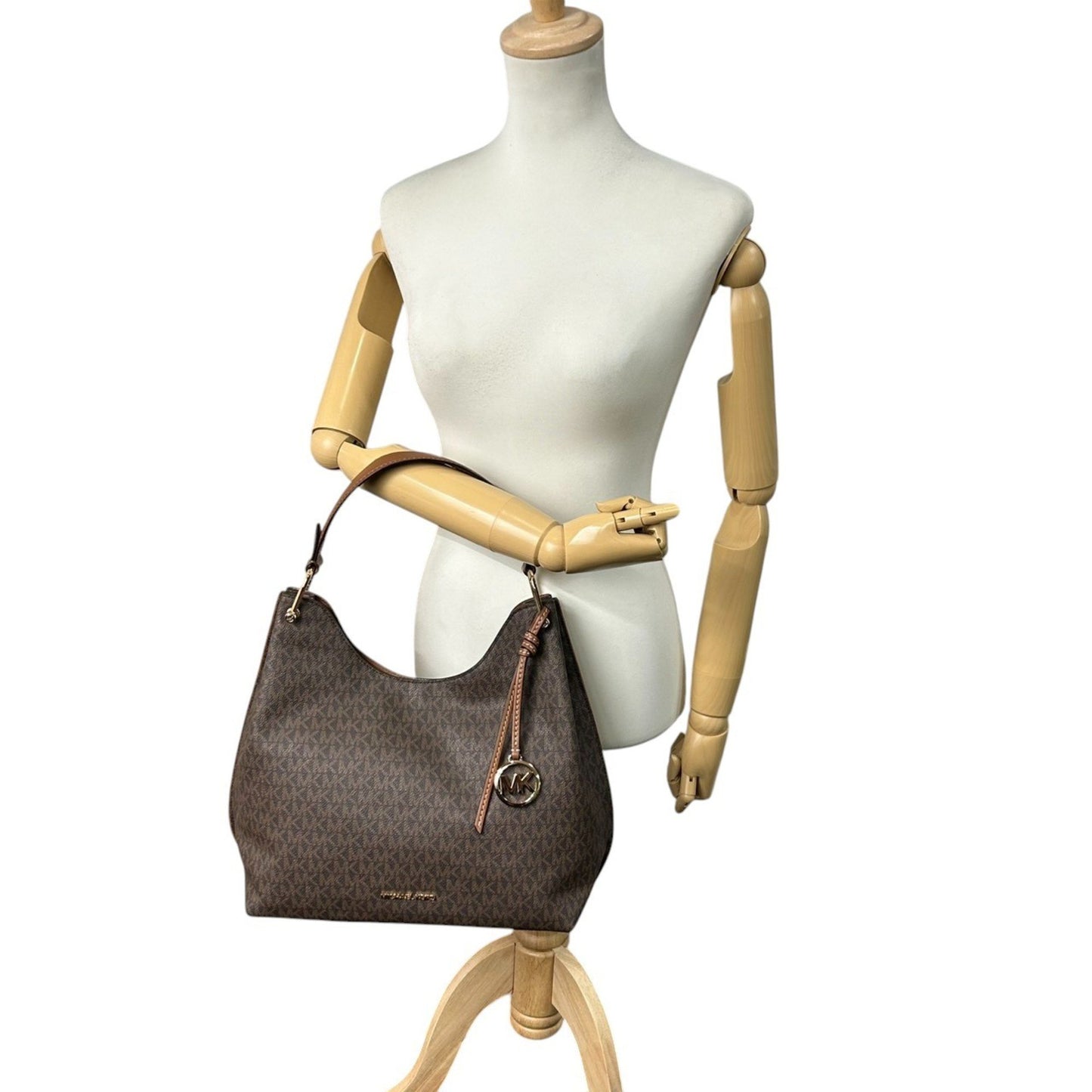 Michael Kors One-Shoulder Hobo Bag With Signature Mk Logo Charm In Brown Leather