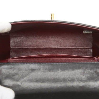 Chanel Matelasse Coco Mark Handbag In Black Lambskin