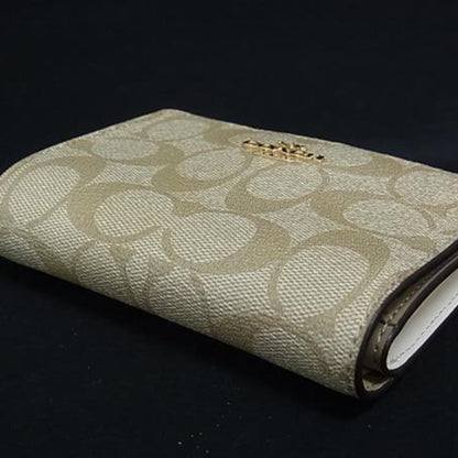 Coach Kisslock Medium Bifold Wallet C8724 In Beige Signature Canvas