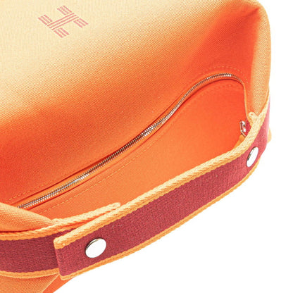 Hermes Herms Bride A Black Gm Handbag In Orange Canvas