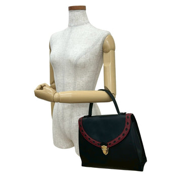 Yves Saint Laurent Ysl Logo Cutout Perforated Leather Handbag In Black