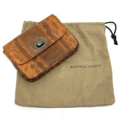 Bottegaveneta Pouch Leather Orange Embossed Turn Lock Women