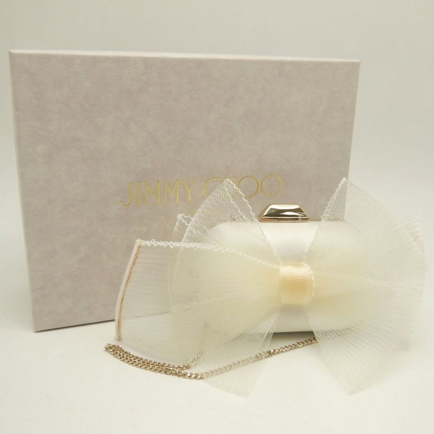 Satin clutch bag by Jimmy Choo