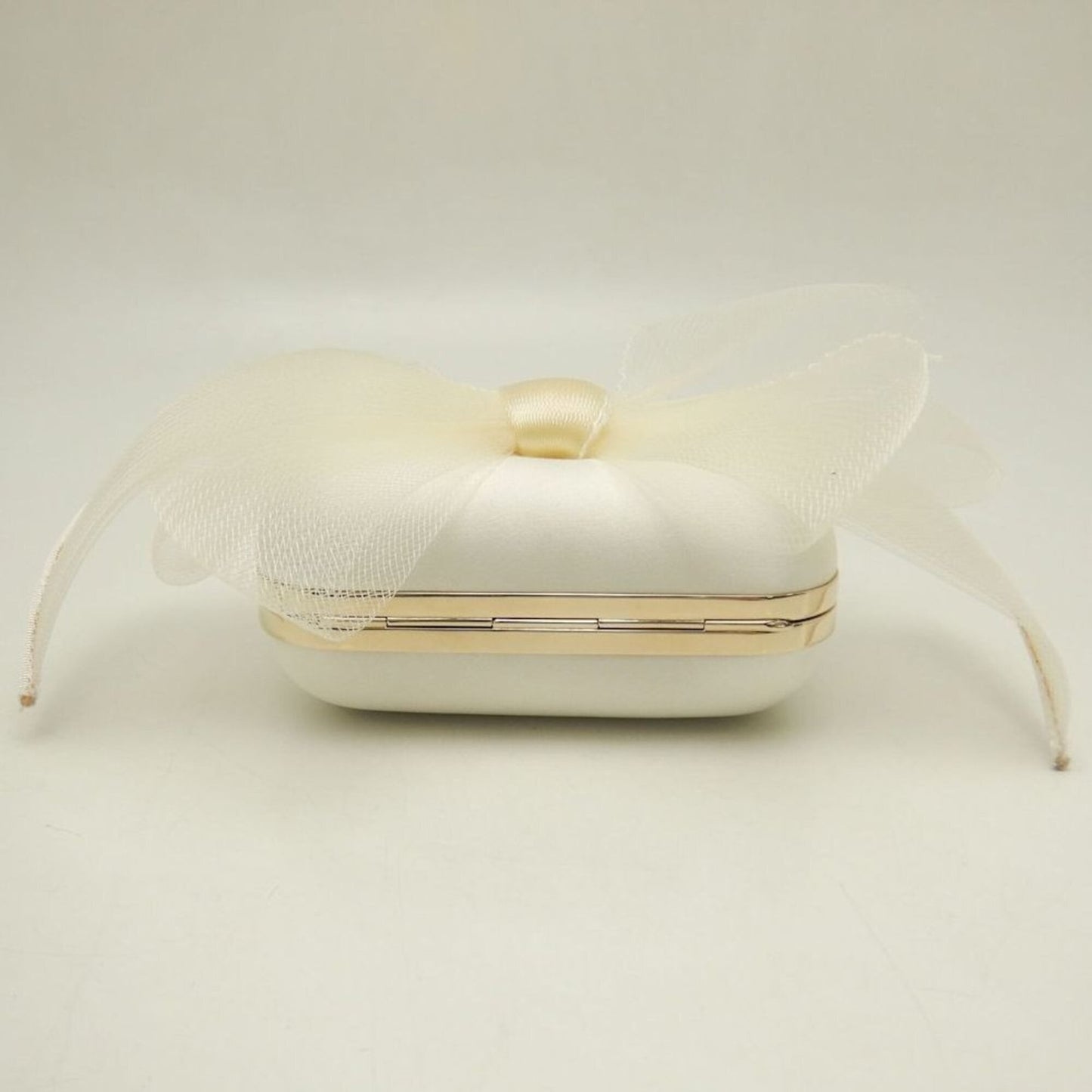 Satin clutch bag by Jimmy Choo