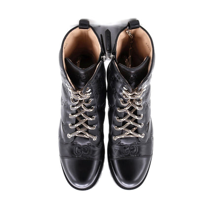 Gucci Women'S Platform Lug Sole Combat Boots Gg Embossed Leather
