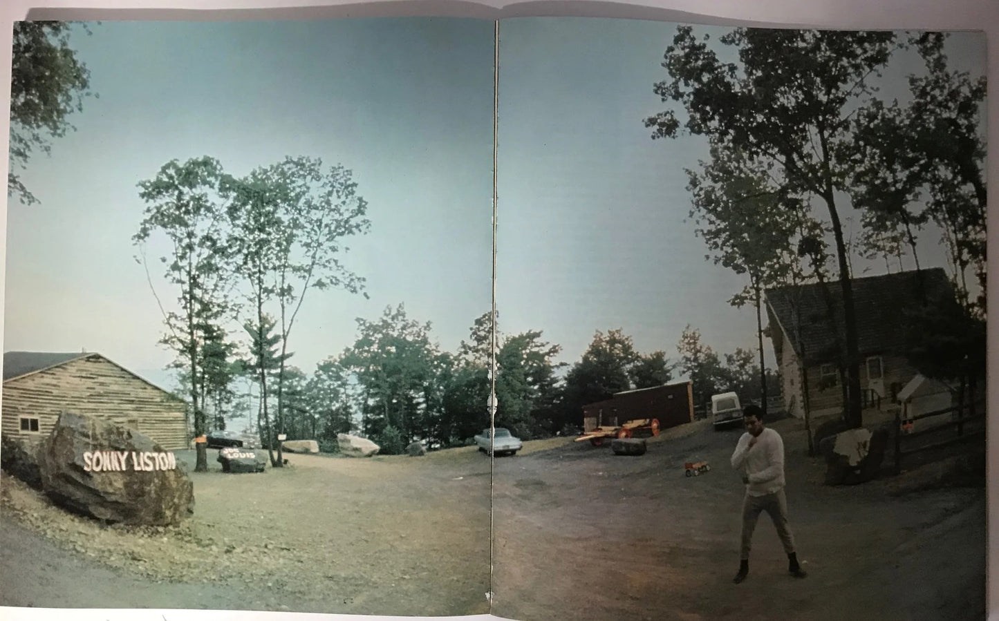 Muhammad Ali Signed Soft Cover Book (Sportscard Guaranty Authentic)