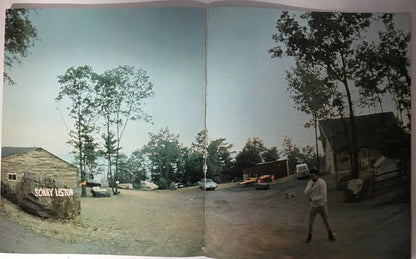 Muhammad Ali Signed Soft Cover Book (Sportscard Guaranty Authentic)