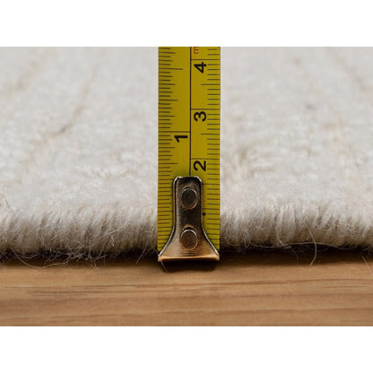 Hand knotted ivory wool with modern tone on tone textured round