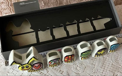 Multicolor ceramic character set by James Rizzi