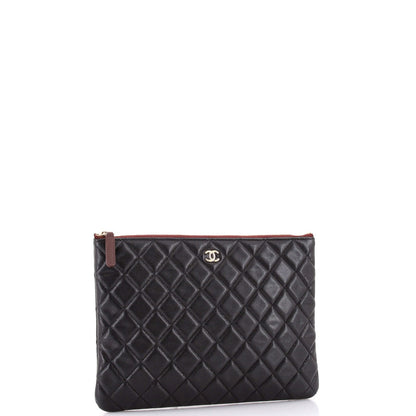 Chanel O Case Clutch Quilted Lambskin Medium