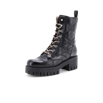 Gucci Women'S Platform Lug Sole Combat Boots Gg Embossed Leather