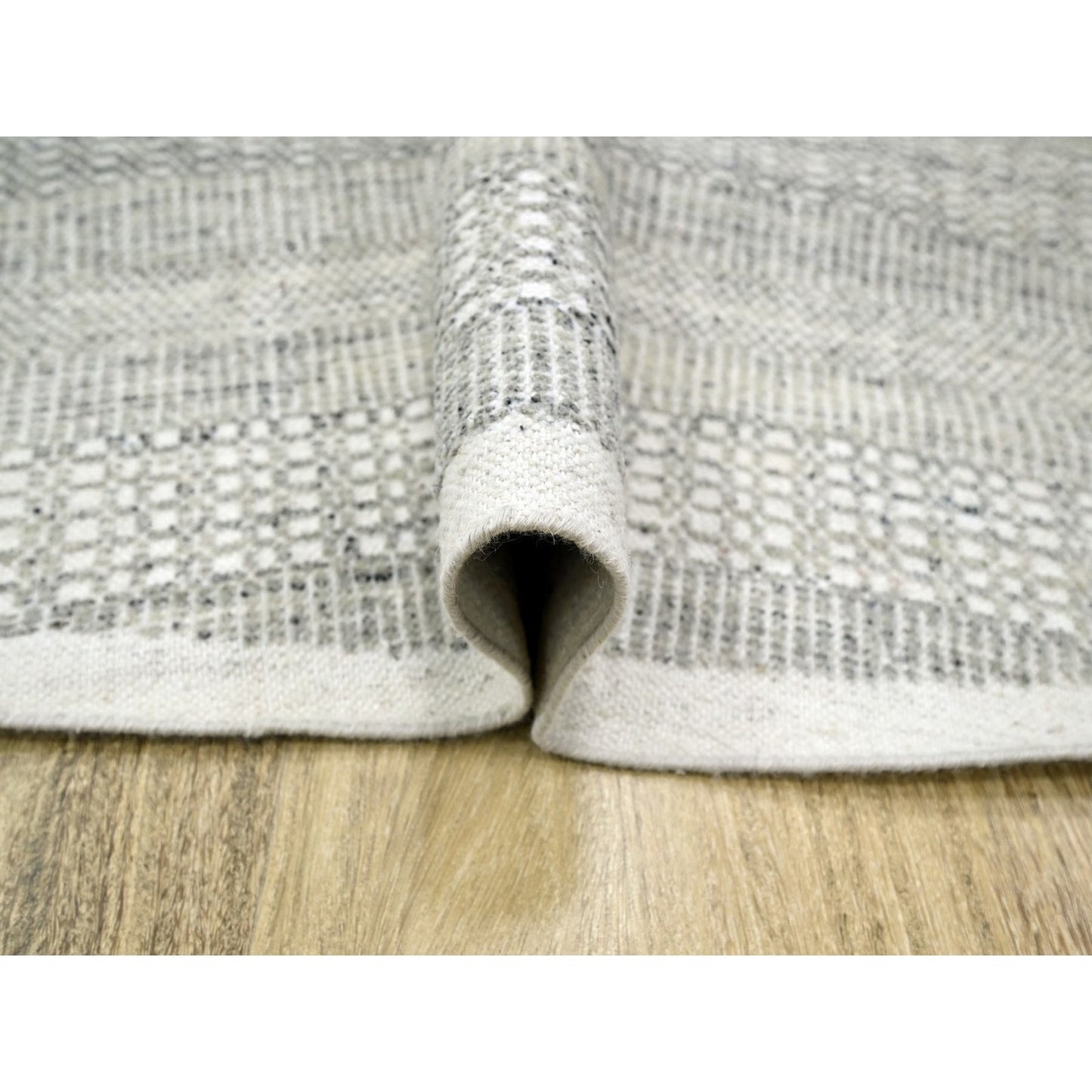 Hand knotted wool rug round oxidized distressed grass design gray