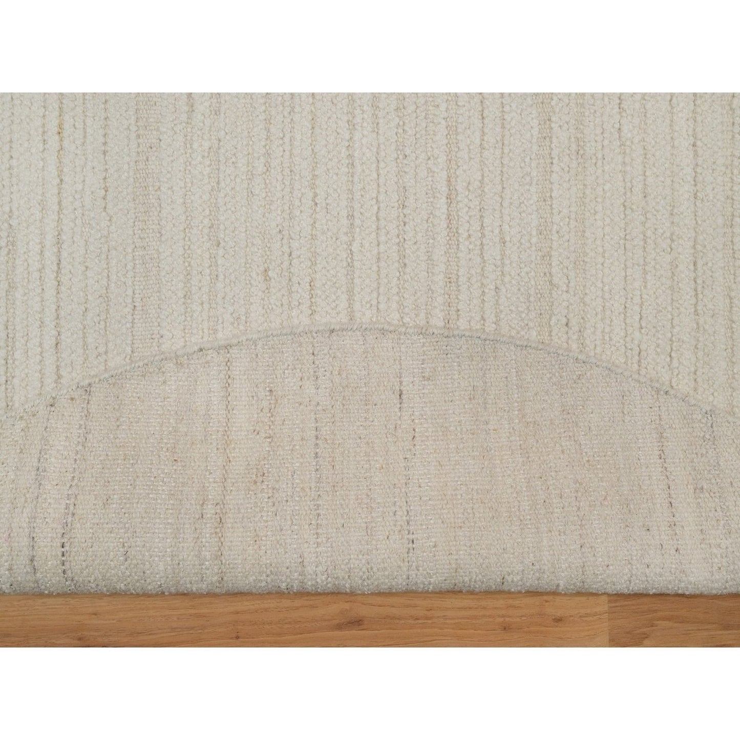 Hand knotted ivory wool with modern tone on tone textured round