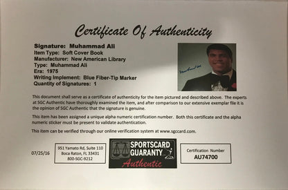 Muhammad Ali Signed Soft Cover Book (Sportscard Guaranty Authentic)
