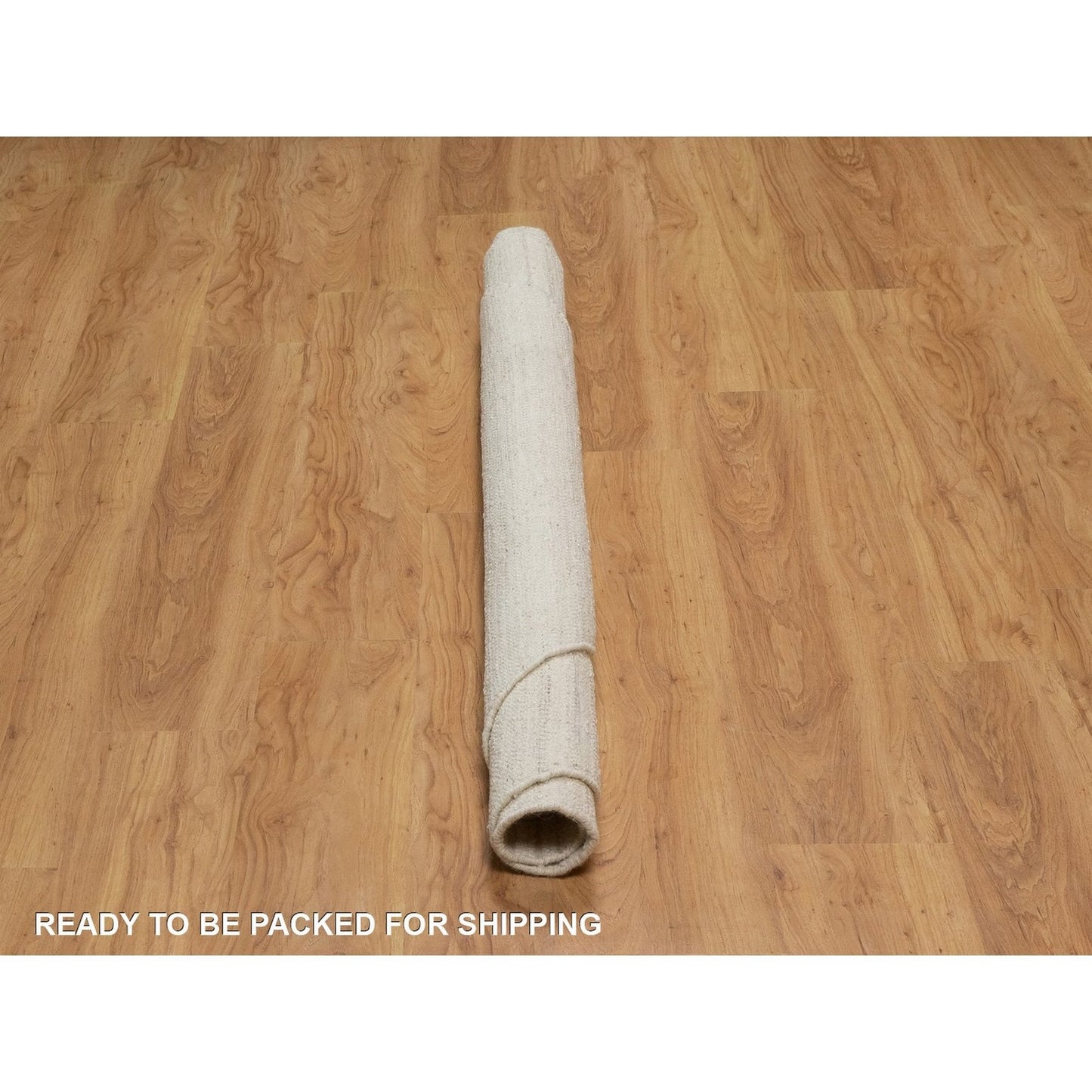 Hand knotted ivory wool with modern tone on tone textured round