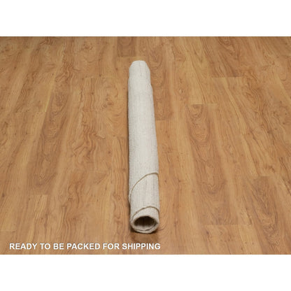 Hand knotted ivory wool with modern tone on tone textured round