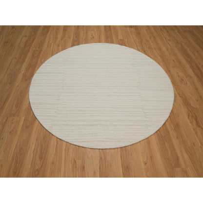 Hand knotted ivory wool with modern tone on tone textured round