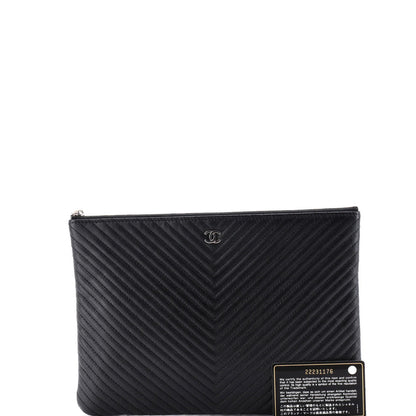 Chanel O Case Clutch Chevron Caviar Medium