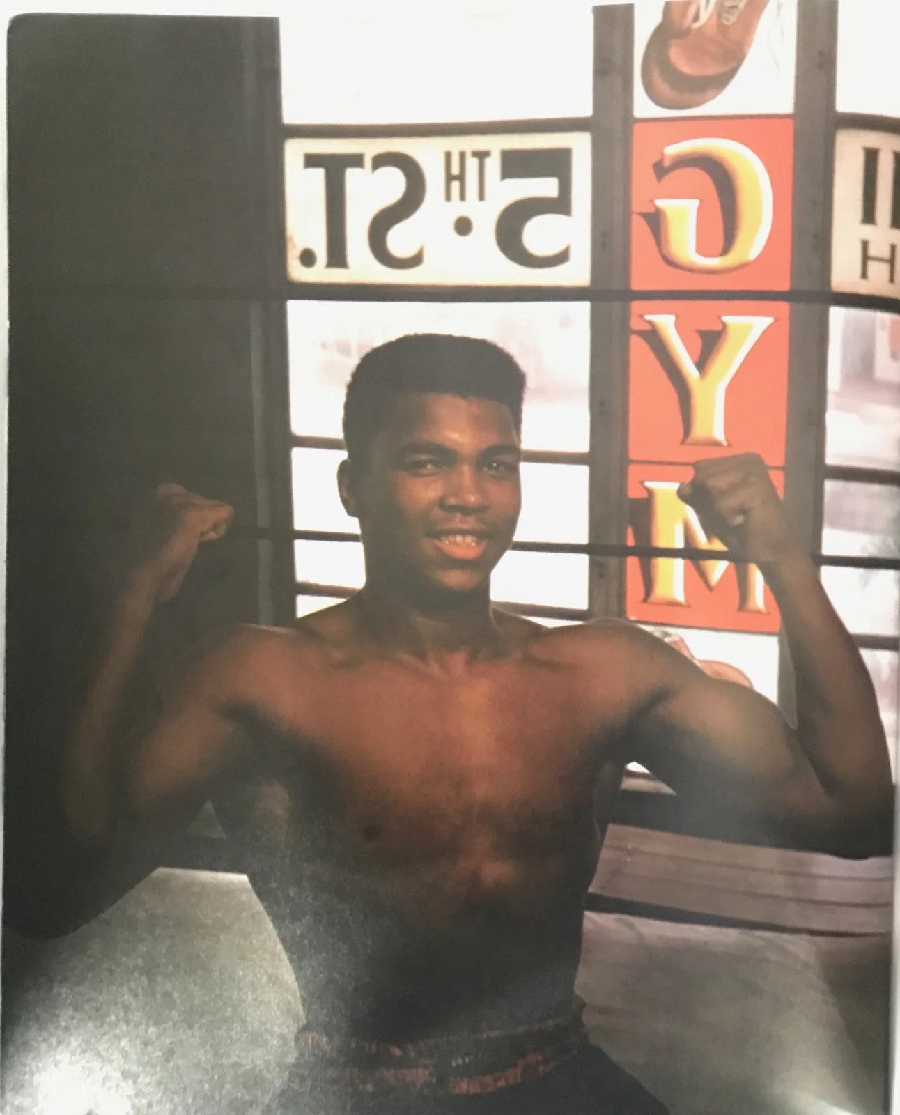 Muhammad Ali Signed Soft Cover Book (Sportscard Guaranty Authentic)