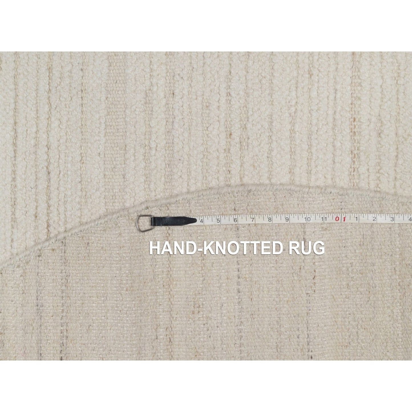 Hand knotted ivory wool with modern tone on tone textured round